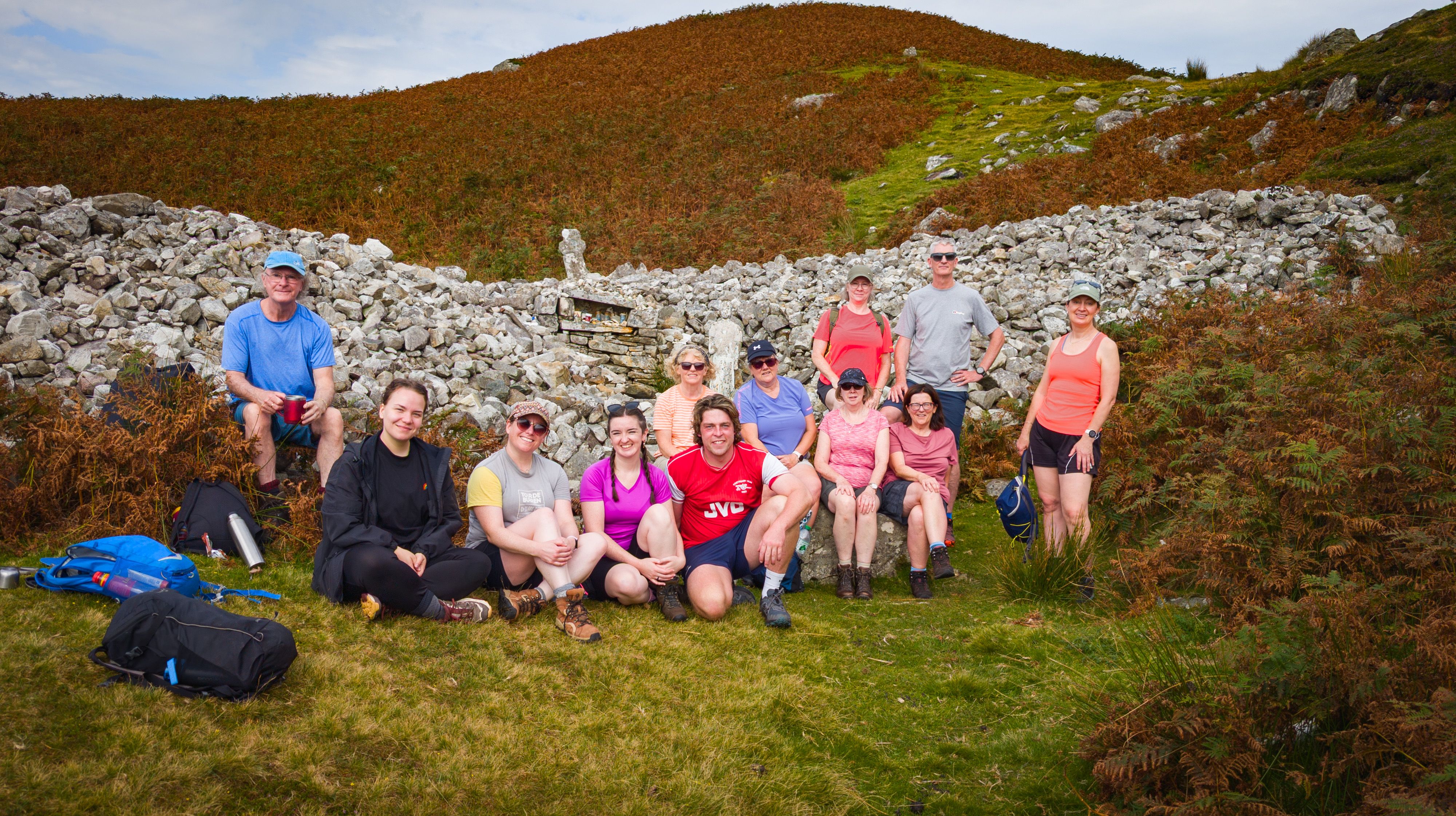 Participants on an Oideas Gaell hill walking course visit Tobar Cholmcille (Colm Cille's well), Gleann Cholm Cille