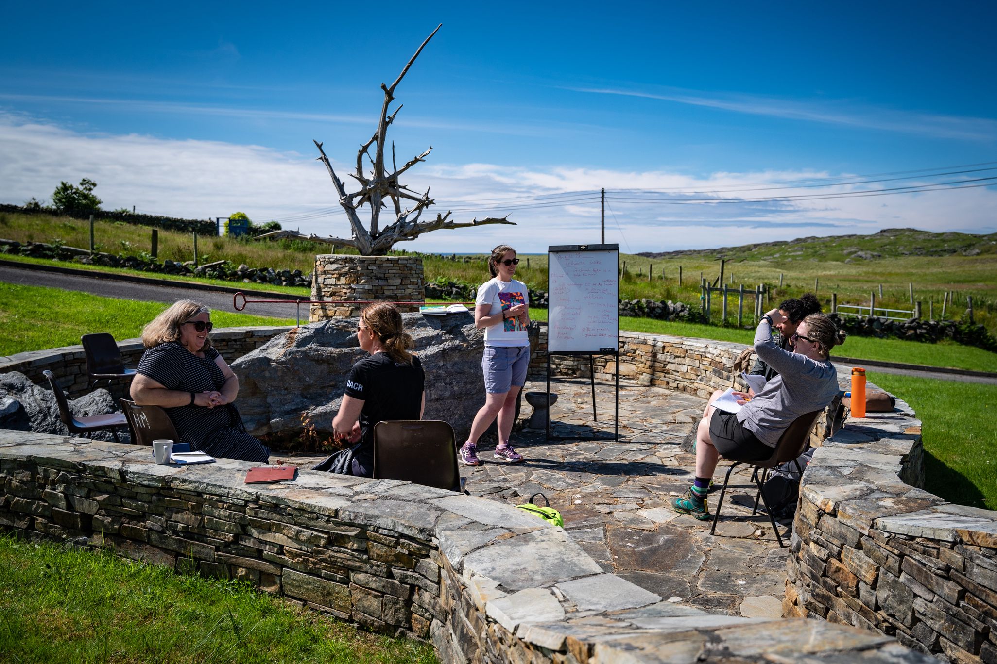 An Irish language class takes place outdoors