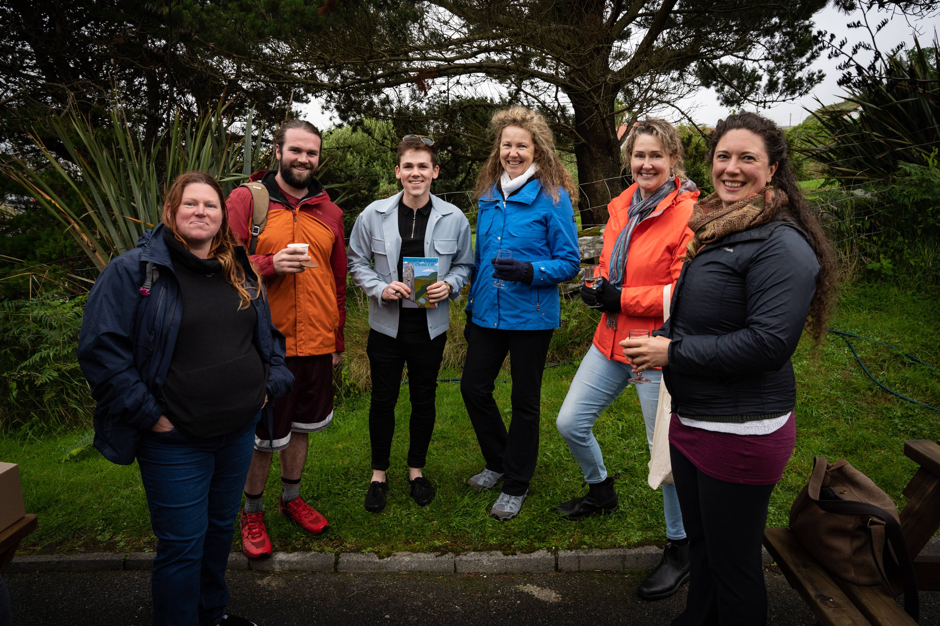 A group of people attend a book launch in Oideas Gael